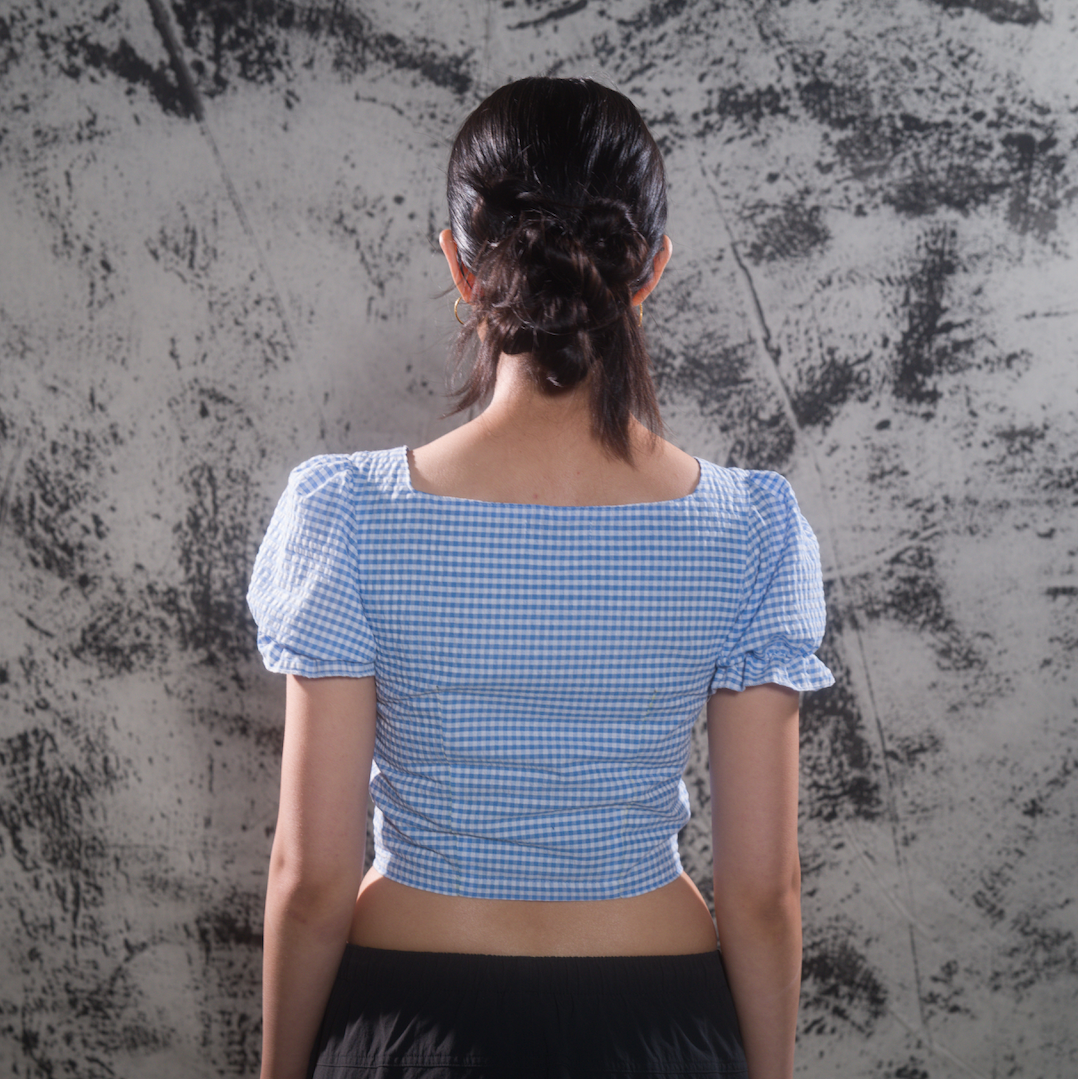 Back view of gingham puff-sleeve cropped blouse
