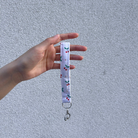 Cherry Heart Wristlet key holder held vertically with visible clasp